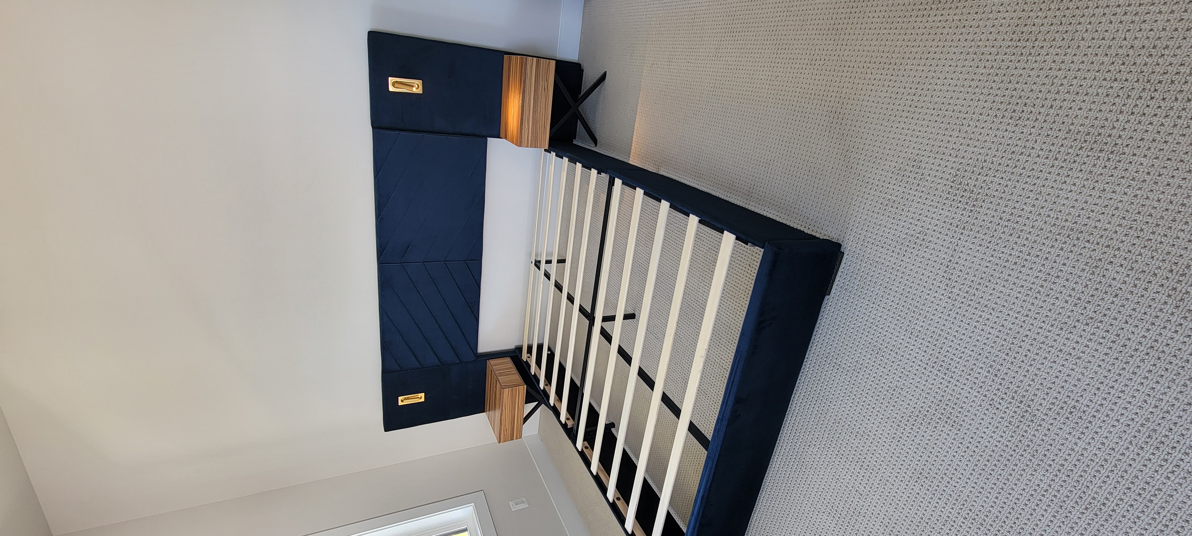 bed with nightstand and lights